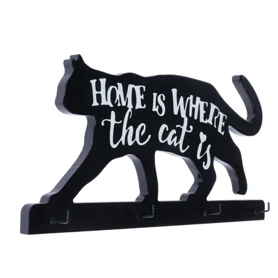 Llavero negro con forma de gato y texto blanco: 'Home is where the cat is'.
