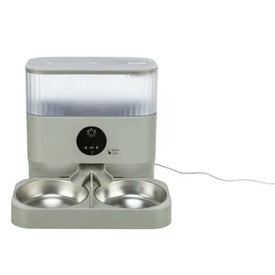 Automatic feeder with two stainless steel bowls, control via control panel and visible power cable connection.