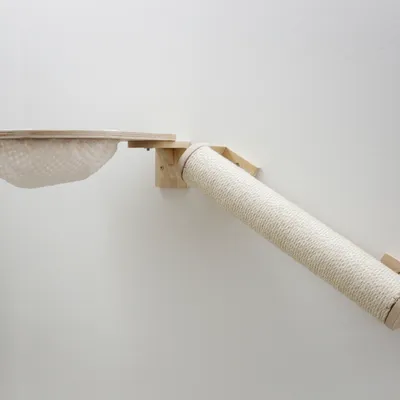 Wall-mounted scratching furniture made of wood with sisal scratching roll and hammock made of woven material.