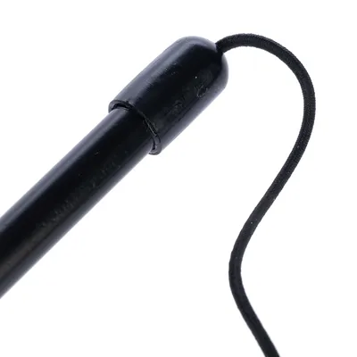 Black rod with elastic cord, suitable for toys or accessories.