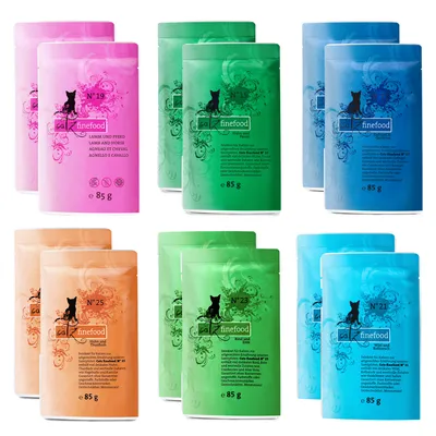 Varios sobres de comida húmeda para gatos catz finefood, 85 g cada uno, en envases de colores con números visibles: N°19, N°15, N°21, N°25, N°23. Textos en alemán e inglés.