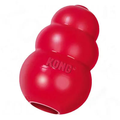 Giocattolo per cani KONG rosso in gomma, forma a tre sezioni con foro visibile su un lato e marchio KONG impresso sulla superficie.