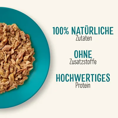 100% NATÜRLICHE Zutaten, OHNE Zusatzstoffe, HOCHWERTIGES Protein (besedilo v nemščini) poleg krožnika z mesno hrano.
