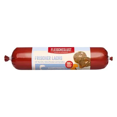 Fleischeslust Frischer Lachs, met wortel, kokosvlokken en spirulina. 100% puur vlees. Worstvormige verpakking met productnaam en ingrediënten zichtbaar op het etiket.