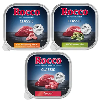 Three packs of Rocco Classic wet food: Beef with poultry hearts, Beef with green tripe, and Pure beef. Each pack states 100% fresh ingredients and grain-free, 300g.