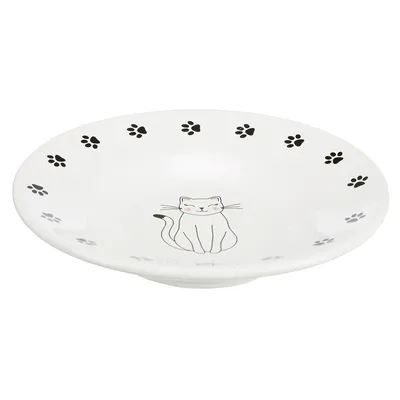 White feeding bowl with black paw pattern and a drawing of a sitting cat in the centre.