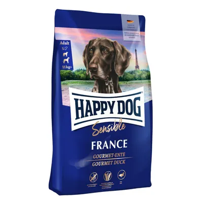 Sac de croquettes Happy Dog Sensible France Gourmet-Ente Gourmet Duck, adulte, 11 kg+, sans additifs conservateurs, image d’un chien devant la tour Eiffel. Texte en anglais et allemand.