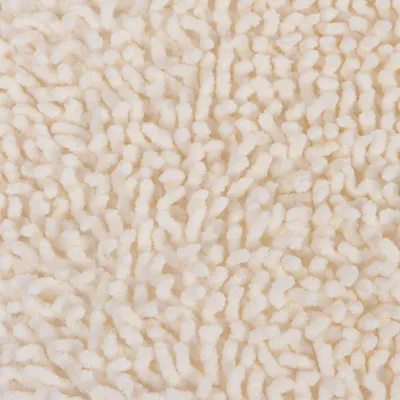 Gros plan sur une surface en tissu beige à texture chenille, fibres épaisses et bouclées visibles. Matériau textile uniquement.