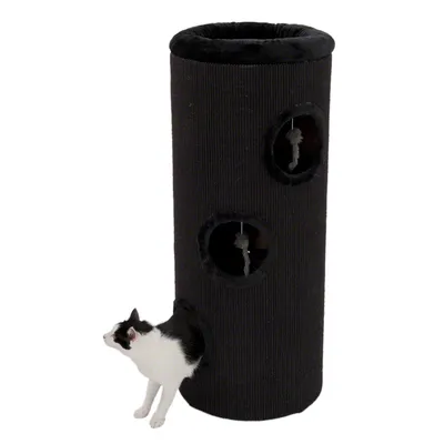 Tour à griffer noire en tissu avec trois ouvertures rondes, deux jouets suspendus visibles et un chat noir et blanc sortant de l’ouverture du bas. Tour à griffer noire en tissu avec trois ouvertures rondes, deux jouets suspendus visibles et un chat noir et blanc sortant de l’ouverture du bas.