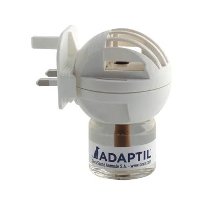 Plug-in diffuser with ADAPTIL refill bottle attached, showing product ready for use in a standard UK socket.