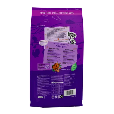 Back of pet food bag showing feeding guide, nutritional information, ingredient highlights such as grain-free fish, salmon oil, and natural ingredients, plus approval by vets and made in the UK.