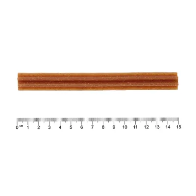 Rjav žvečilni prigrizek v obliki palice, dolžina približno 15 cm, z merilom za prikaz velikosti.