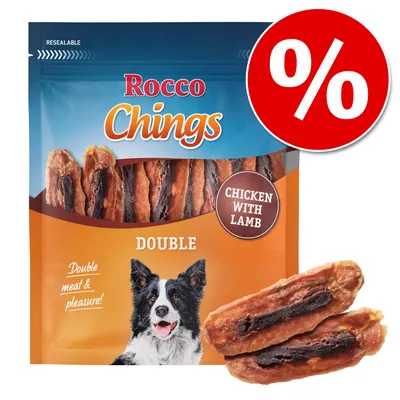 Rocco Chings DOUBLE, Chicken with Lamb, sachet refermable avec friandises visibles et illustration de chien. Texte anglais : Double meat & pleasure! Signe pourcentage en haut à droite.