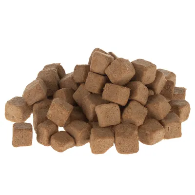 Brown, cube-shaped dry food pieces stacked. Product image without packaging.