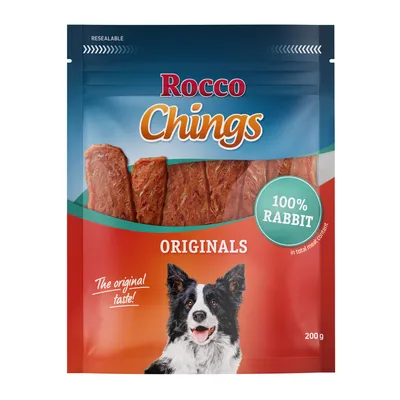 Rocco Chings Originals, 100% Rabbit, The original taste!, 200 g. Billede af hund på emballagen. Synlige kødstrimler i posen.