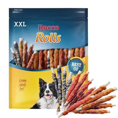 Bolsa XXL Rocco Rolls, variedad de snacks enrollados para perros. Texto visible: 'Crispy, chewy fun!', 'BEST OF'. Imagen de perro en el envase y varios snacks delante.