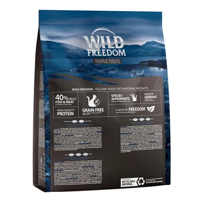 WILD FREEDOM Triple Taste, 40% fresh fish & meat, high-quality protein, grain-free recipe, species-appropriate, made in Germany, recyclable material. Blue bag with product details visible.