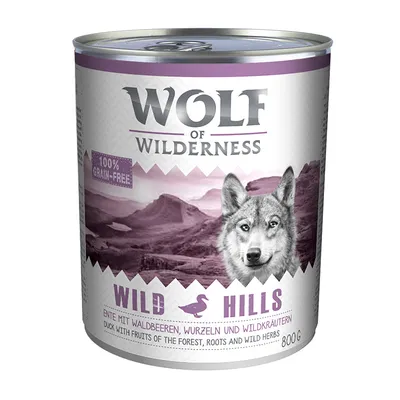 Консерва Wolf of Wilderness Wild Hills, 800 г. Видна надпись: 100% grain-free. Текст на английском и немецком: Duck with fruits of the forest, roots and wild herbs.