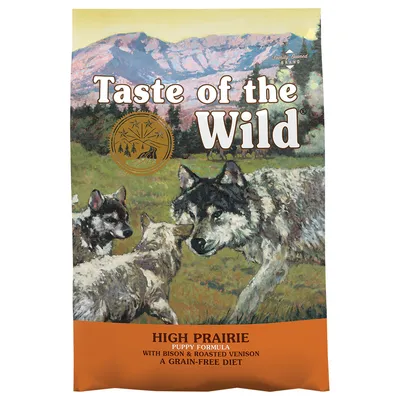 Taste of the Wild High Prairie Puppy Formula with Bison & Roasted Venison, A Grain-Free Diet. Narančasta ambalaža s ilustracijom vukova na livadi. Taste of the Wild High Prairie Puppy Formula with Bison & Roasted Venison, A Grain-Free Diet. Narančasta ambalaža s ilustracijom vukova na livadi.