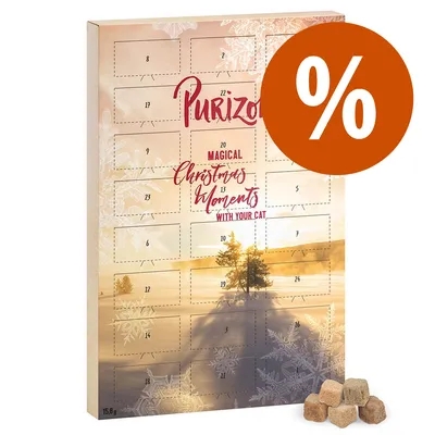 Adventní kalendář Purizon s nápisem 'Magical Christmas Moments with your cat', oranžové procento, několik kostek pamlsků vpravo dole, hmotnost 15,8 g.