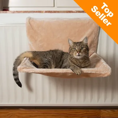 Cat lying on a beige radiator-mounted bed with an orange corner banner reading 'Top Seller'. Cat lying on a beige radiator-mounted bed with an orange corner banner reading 'Top Seller'.