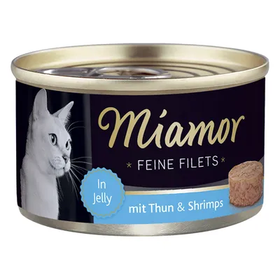 Miamor Feine Filets In Jelly mit Thun & Shrimps, lattina di alimento per gatti con immagine di un gatto bianco e filetto visibile sull'etichetta. Testo in tedesco e inglese.