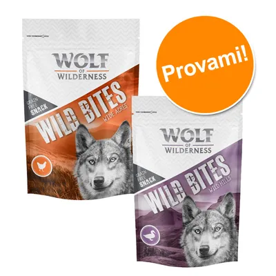 Wolf of Wilderness Wild Bites snack senza cereali, varianti Wide Acres e Wild Hills. Testo visibile: 'Provami!'. Immagine di lupo su entrambe le confezioni.