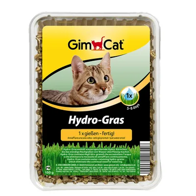 GimCat Hydro-Gras, förpackning med bild på katt och text: 1 x gießen – Fertig!, 5–8 days, 150 g. Synligt gräs och hydro-korn i plastförpackning.