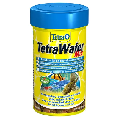 Упаковка корма для рыб TetraWafer Mix с изображением разноцветных рыб и креветки, надписью Spirulina и текстом на нескольких языках о пользе для здоровья, окраса и жизненной силы. Упаковка корма для рыб TetraWafer Mix с изображением разноцветных рыб и креветки, надписью Spirulina и текстом на нескольких языках о пользе для здоровья, окраса и жизненной силы.
