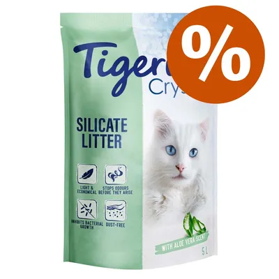 Tigerino Crystals Silicate Litter, con aroma a aloe vera, 5L. Texto en inglés: light & economical, stops odours before they arise, inhibits bacterial growth, dust-free. Símbolo de porcentaje.
