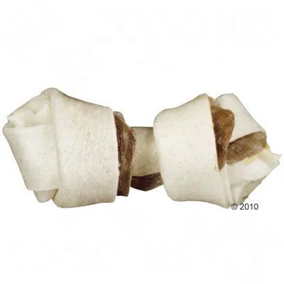 Ossicino annodato per cani in pelle pressata, colore bianco con parte centrale marrone visibile. Nessun marchio o testo presente sull'oggetto.