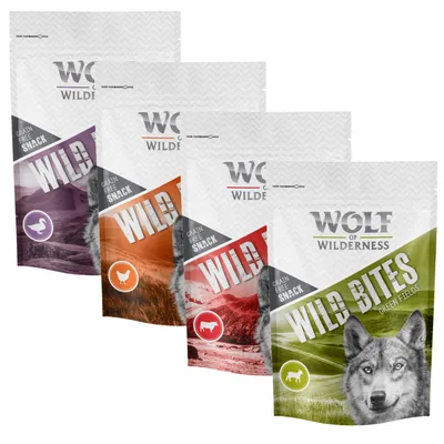 Four packs of grain free snack labelled Wild Bites, each with different colours and animal icons, showing product variety from Wolf of Wilderness.