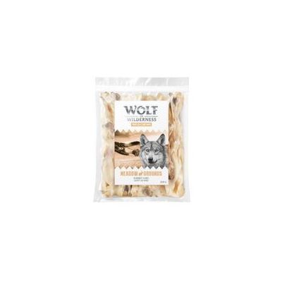 Sachet de friandises pour chien Wolf of Wilderness Meadow Grounds, morceaux clairs visibles à travers l’emballage, texte visible : 200 g.
