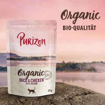Purizon Organic Duck & Chicken mit Zucchini, Bio-Qualität, 85g. 13% Fleischanteil. Verpackung zeigt Landschaft mit See und Wald.