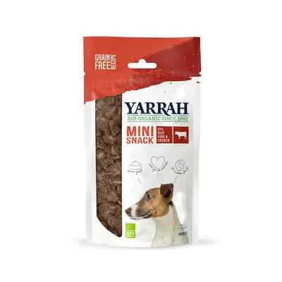 Yarrah Mini Snack, био-органический с 1992 года, беззерновой рецепт, 97% говядина, свинина и курица. Виден био-сертификат. На упаковке изображены собака и информация о продукте. Yarrah Mini Snack, био-органический с 1992 года, беззерновой рецепт, 97% говядина, свинина и курица. Виден био-сертификат. На упаковке изображены собака и информация о продукте.