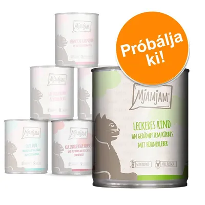 Mjamjam macskaeledel konzerv, elöl: Leckeres Rind an gedämpftem Kürbis mit Hühnerleber. Narancssárga körben: Próbálja ki! Háttérben további Mjamjam ízek német felirattal. Mjamjam macskaeledel konzerv, elöl: Leckeres Rind an gedämpftem Kürbis mit Hühnerleber. Narancssárga körben: Próbálja ki! Háttérben további Mjamjam ízek német felirattal.