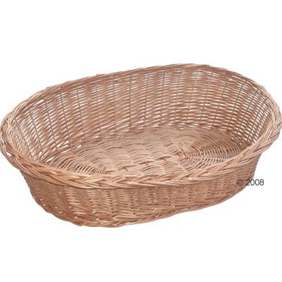 Cesta ovalada de mimbre trenzado, sin cojín ni accesorios visibles. Material: mimbre natural. Vista del interior y los bordes elevados.