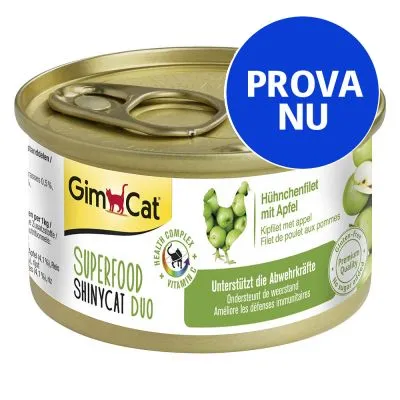 GimCat Superfood ShinyCat Duo, burk med text: Hühchenfilet mit Apfel, Health Complex Vitamin C, PROVA NU. Bild på gröna äpplen och kyckling. Text på flera språk om immunförsvar.