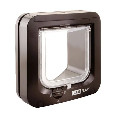 Square pet door with transparent flap and manual lock control, showing SureFlap branding and directional lock symbols on the front panel. Square pet door with transparent flap and manual lock control, showing SureFlap branding and directional lock symbols on the front panel.