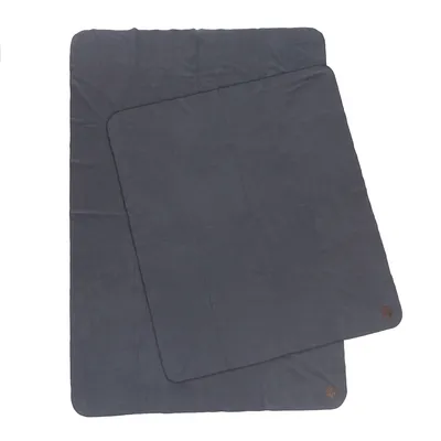 Two dark grey, rectangular mats with rounded corners and a small brown logo in the corner.