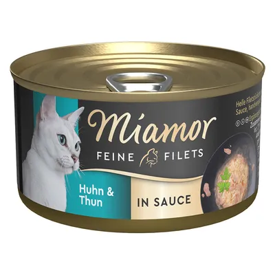 Boîte Miamor Feine Filets Huhn & Thun in Sauce, image d’un chat blanc et d’un plat de filets en sauce sur l’étiquette. Texte principal en allemand et anglais.