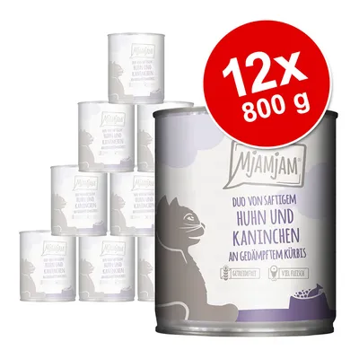 Lot de 12 boîtes MjAMjAM 800 g, texte visible : Duo von saftigem Huhn und Kaninchen an gedämpftem Kürbis. Mention sans céréales et riche en viande sur l’étiquette.