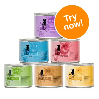 Six tins of catz finefood wet cat food, varieties N° 11, N° 13, N° 3, N° 5, N° 9, N° 7. Large orange badge with white text: Try now!