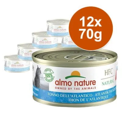 Sada 12 konzerv Almo Nature HFC Natural, Atlantikthunfisch, každá 70 g. Viditelný nápis: '100% profits to nature', 'OWNED BY THE ANIMALS'.