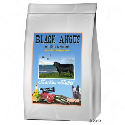 Markus-Mühle Black Angus mit Ente & Hering Junior 15 kg koiranruokapakkaus, etiketissä naudan kuva, ankka, silli, öljypullo ja koira. Teksti: garantiert kaltgepresst, NATURNAH ERNÄHREN.