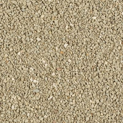 Close-up van beige kattengrit met grove korrels, geen merknaam of verpakking zichtbaar.