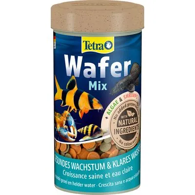 Tetra Wafer Mix, met algen en garnalen, natuurlijke ingrediënten, geen kleurstoffen of conserveermiddelen. Voor gezonde groei en helder water. Afbeelding van verschillende aquariumvissen op verpakking.