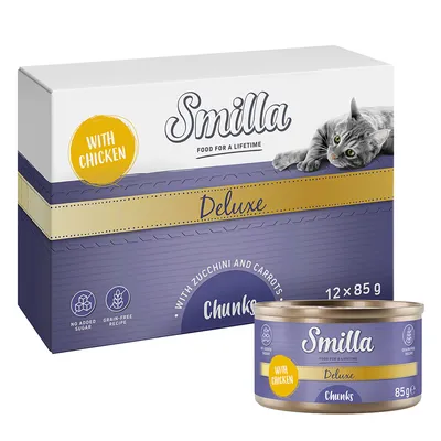 Smilla Deluxe Chunks with chicken, with zucchini and carrots, 12 x 85 g. Sans sucre ajouté, recette sans céréales. Boîte et barquette visibles avec un chat sur l’emballage.