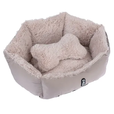 Panier pour animal en tissu beige à intérieur doux, avec coussin en forme d’os assorti. Marque TIA visible sur le devant.