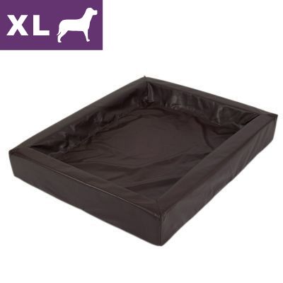Suorakulmainen ruskea koiranpeti, näkyvissä XL-kokomerkkintä ja koirasiluetti vasemmassa yläkulmassa. Materiaali näyttää keinonahalta.